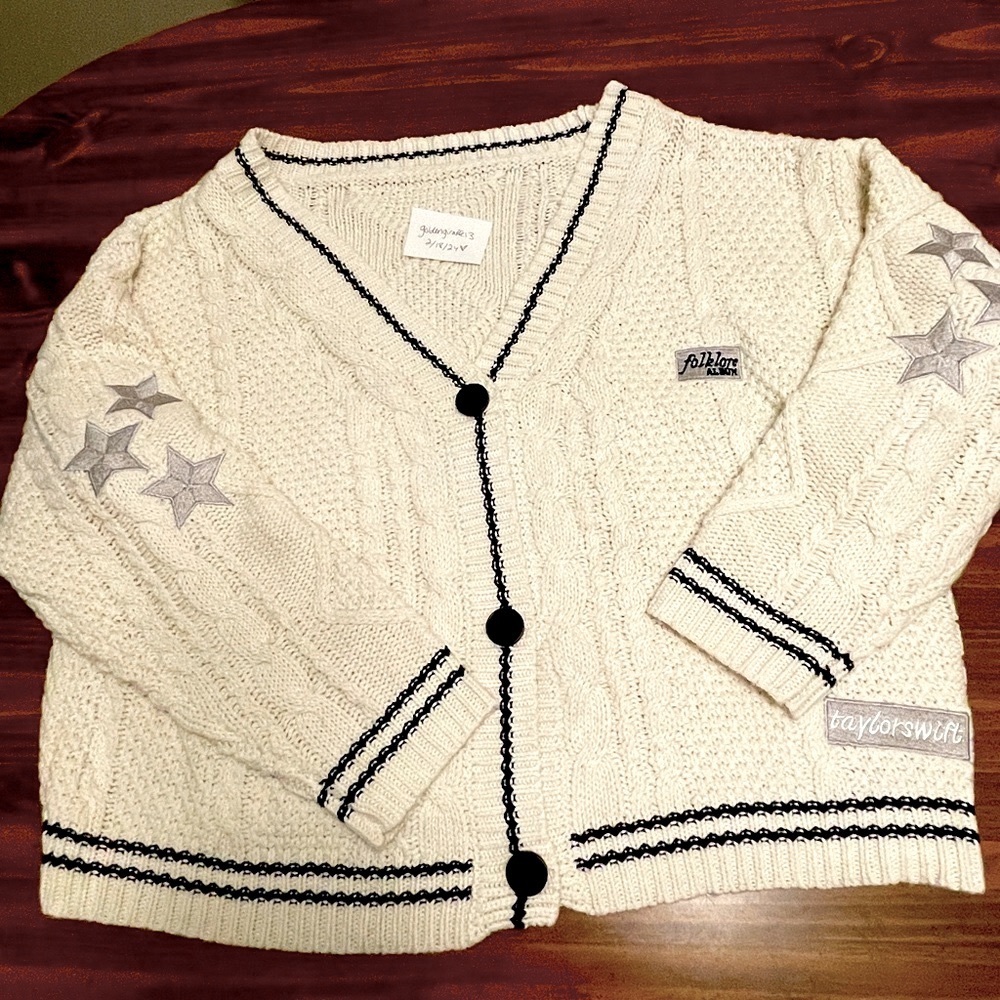 Taylor Swift Cream Cardigan with Black Trim and Gray Stars